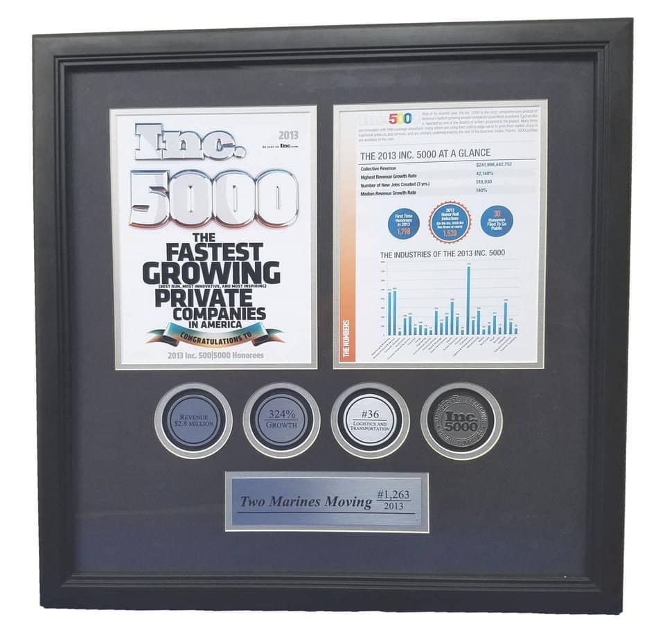 Framed award display with coins and achievement certificate for 5000 sales.